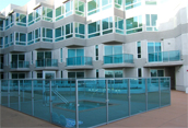 glass & aluminum railing system around pool