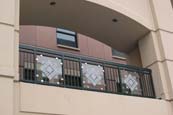 aluminum railing with decorative glass panel inserts